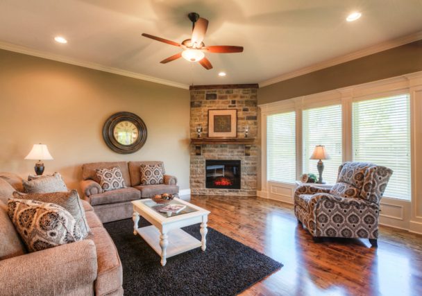 Sweetwater Creek New Homes in Spring Hill, KS Living Room with Stone Fireplace